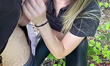 Amateur blonde gives a close-up blowjob and swallows stranger's cum in the woods